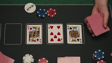 hands managing poker chips on green table, reflecting intense poker gameplay with the element of chance and skill
