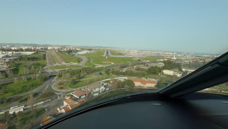 plane approaching and landing at lisbon airport