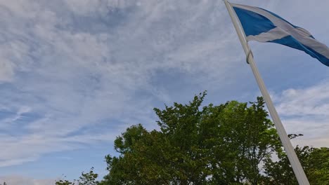 scottish flag waves over scenic stirling view