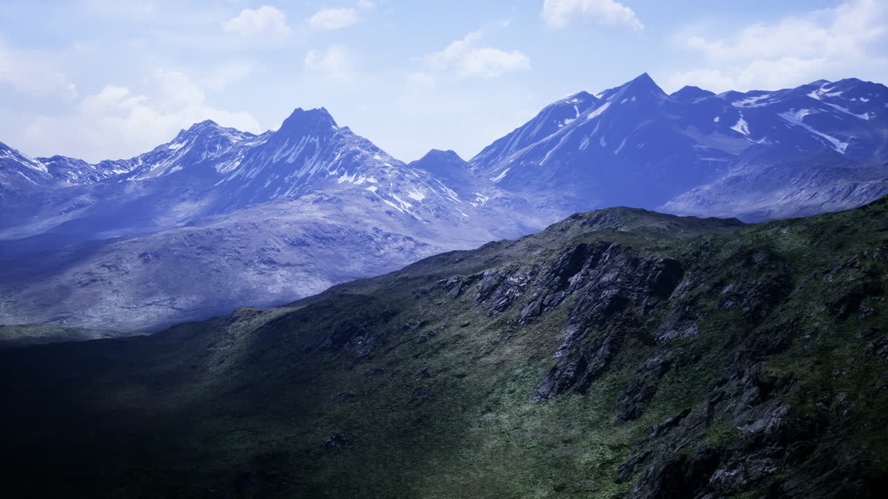 Majestic mountain ranges under a bright sky at midday bring serenity and awe