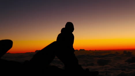 men play at haleakala crater at sunset