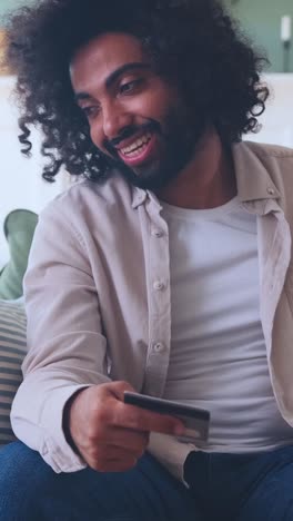 engaging in digital moments while seated in a cozy room
