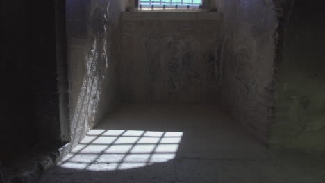 a window of a castle where the sunlight making a realistic view of the history.