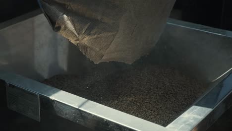 grinding of malt seeds in a mill at a modern brewery