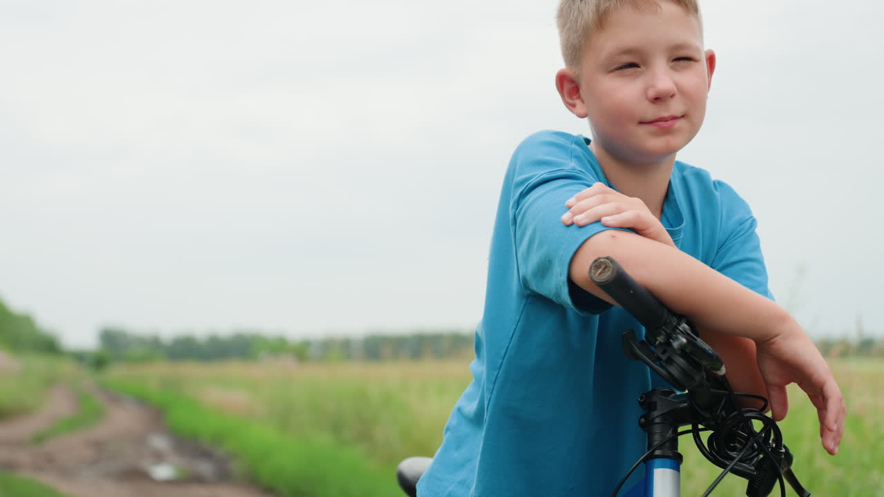 Youthful cyclist tranquility, Young boy riding calmly outdoors, Child on bike exhibits peaceful confidence outdoors, Boy calmly cycling through nature with gentle smile and relaxed attitude