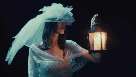 mysterious woman in white dress holding a lantern