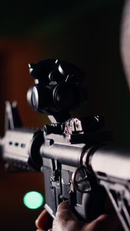 vertical video shooting gallery client hitting targets, extreme close up of rifle