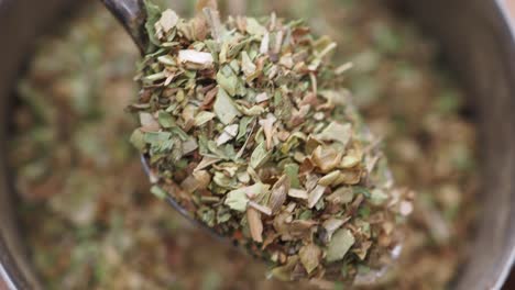 dried herbs and spices on a spoon