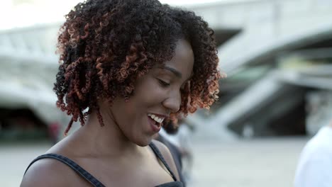 Beautiful-joyful-woman-texting-on-modern-phone