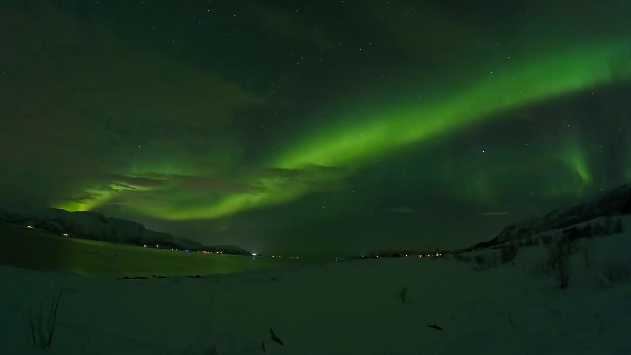 Green Northern lights in Norway. Aurora Borealis time lapse. Northern landscape.