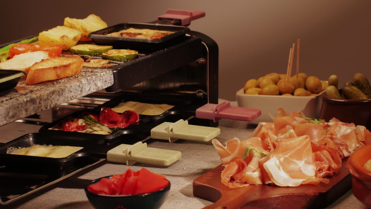 French Swiss or Spanish restaurant with traditional tapas food, Spanish cuisine, delicious tapas and cheese plate, bruschetta with cheese, olives dry tomatoes and tasty sandwich bar appetizer, buffet