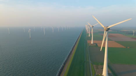 huge windmill turbines, offshore windmill farm in the ocean westermeerwind park , windmills isolated at sea on a beautiful bright day netherlands flevoland noordoostpolder