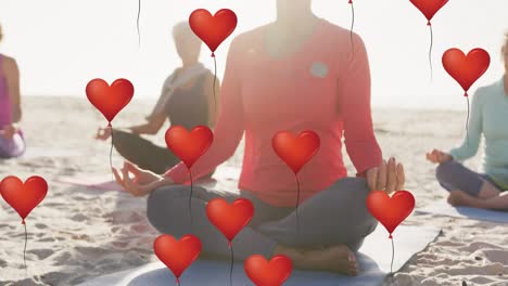 animation of red heart balloons, over women exercising on beach