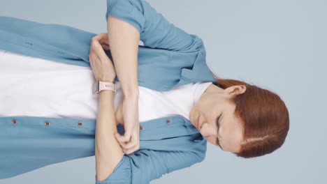 Vertical-video-of-Woman-with-itchy-arms.