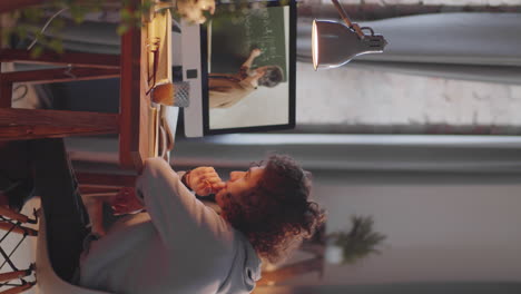 teen schoolboy studying online at home