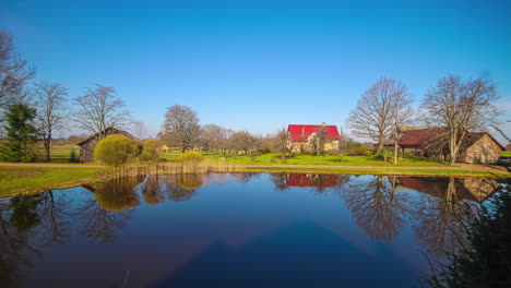 time lapse of lakeside cottages for a full day from sunrise to sunset