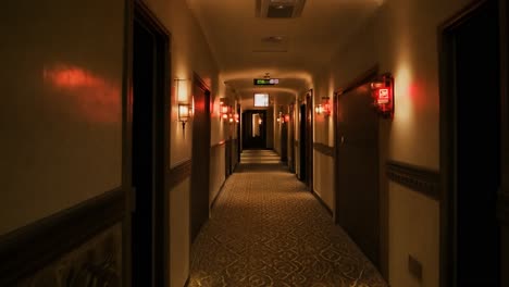 emergency lights gradually illuminating a dark hotel corridor, enhancing safety and signaling potential danger