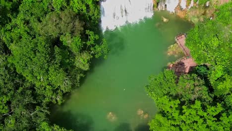 cascading waterfall in the pantanal matogrossense national park in brazil - aerial reveal