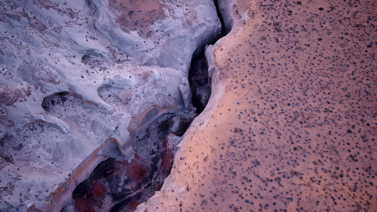 Overhead drone footage capturing a slot canyon in the American Southwest.