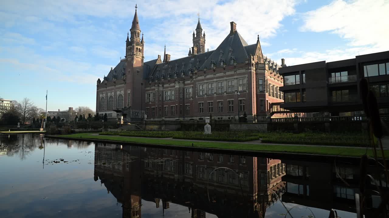 Reflection the beautiful Peace Palace building and most visited building in The Hague and seat of the International Court of Justice at Autumn season