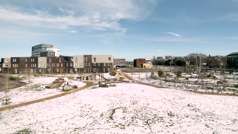 Time-lapse-of-melting-frozen-field-and-fleeting-clouds-at-Ettegerpark-during-sunset-after-a-snowstorm-with-parque-covered-in-snow