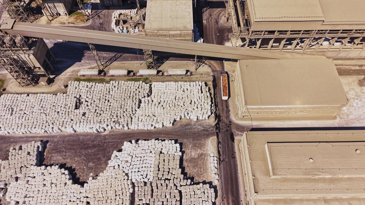 Dust covers industrial area near storage and conveyor system