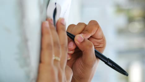 close up of women hand writing on notepad