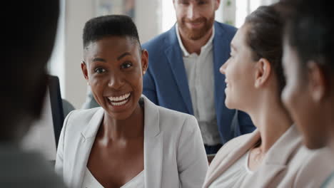 african american business woman chatting with colleagues in office meeting having conversation sharing ideas in corporate workplace