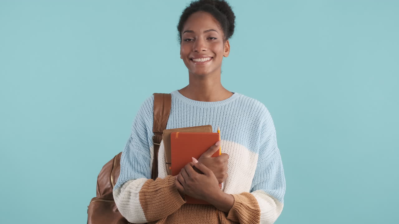Excited woman with school supplies