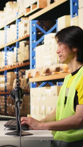 vertical video tired overworked person in hi vis vest scanning shipping labels