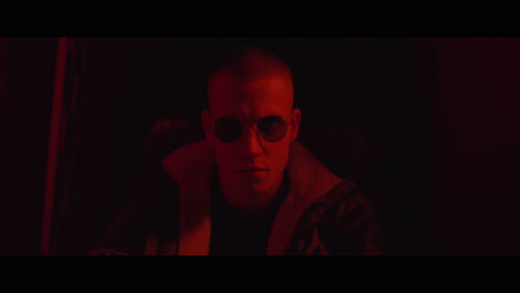 close-up portrait of a man in red light