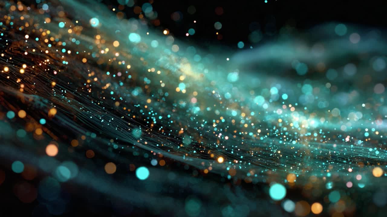 Luminous blue and golden glitter particles with bokeh effect floating in a slow and magical swirling motion across a dark background, creating a mesmerizing and dreamlike abstract texture