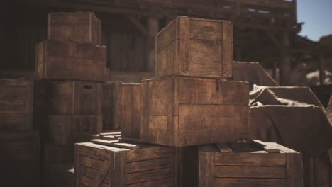 wooden crates stacked in a rustic warehouse during daylight hours