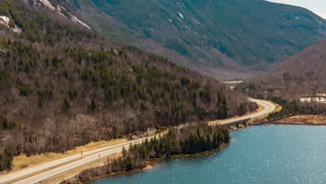 drone aerial motion time lapse of traffic on interstate through mountains shipping and receiving hd 30p