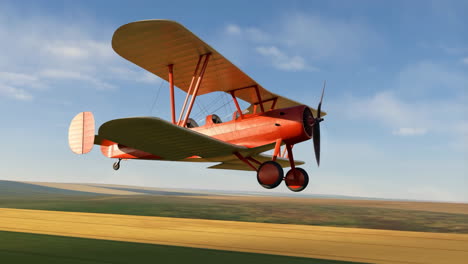 vintage red biplane flying over field