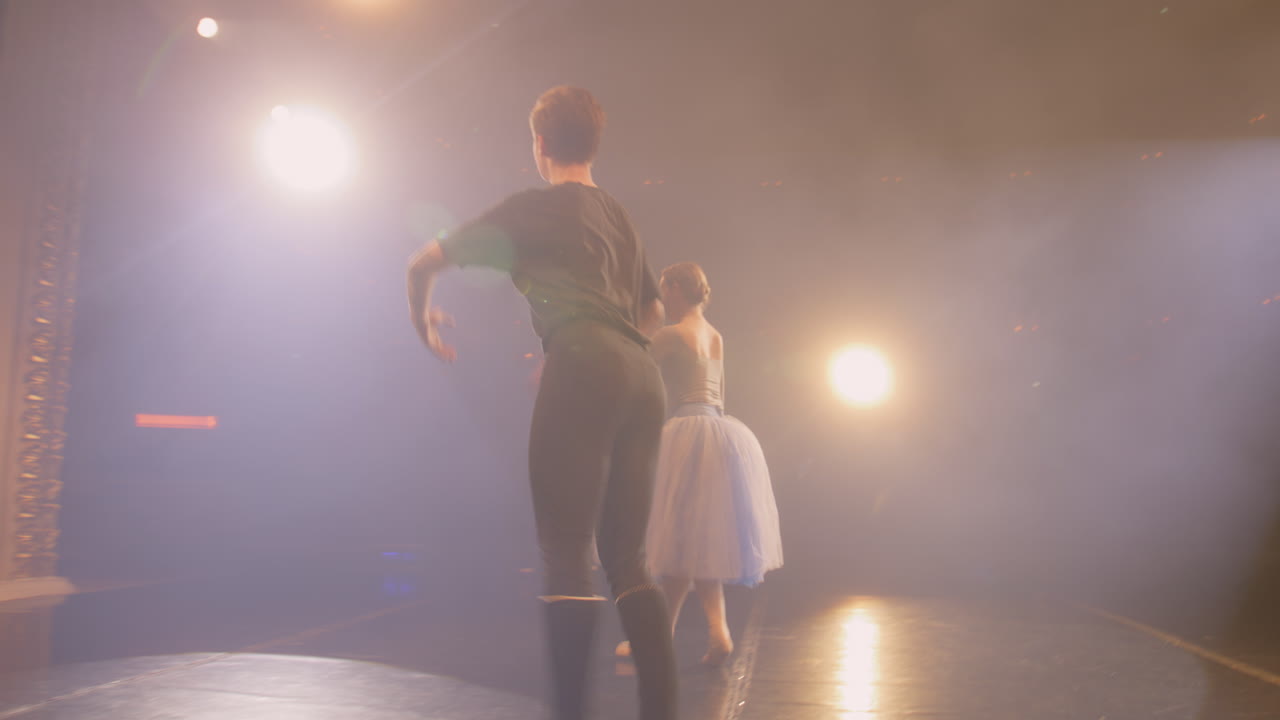 young Ballet Dancer Practicing Young Ballet Dancer Girl in Black Sportswear Practicing alone in Hall Reflecting in Big Mirrors Gracefully Spinning and Jumping in front of High Bright Windows
