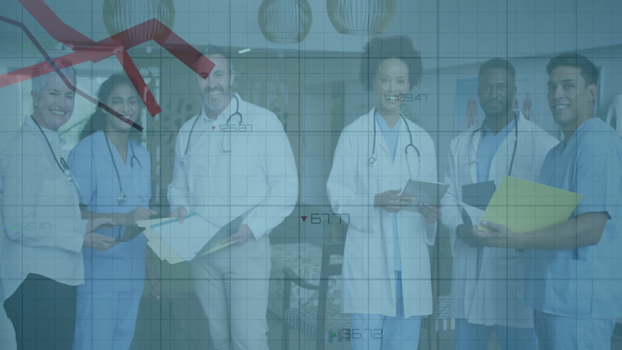 Medical team standing in hospital corridor, holding clipboards and showing falling financial graph