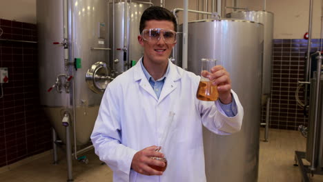 brewery worker checking the product