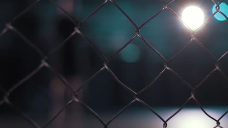 chain link fence at night