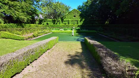 stone-lined garden environment with vivid green surroundings at upper brittany botanical park, le chatellier, france.