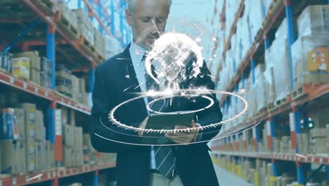 animation of scope scanning and globe over man using tablet in warehouse