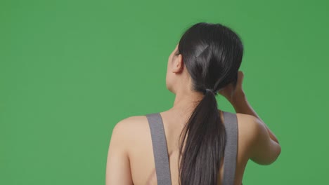 woman back view on green screen