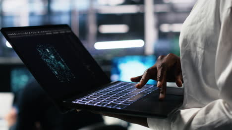 close up of data center technician using tablet to monitor neural network ai llm