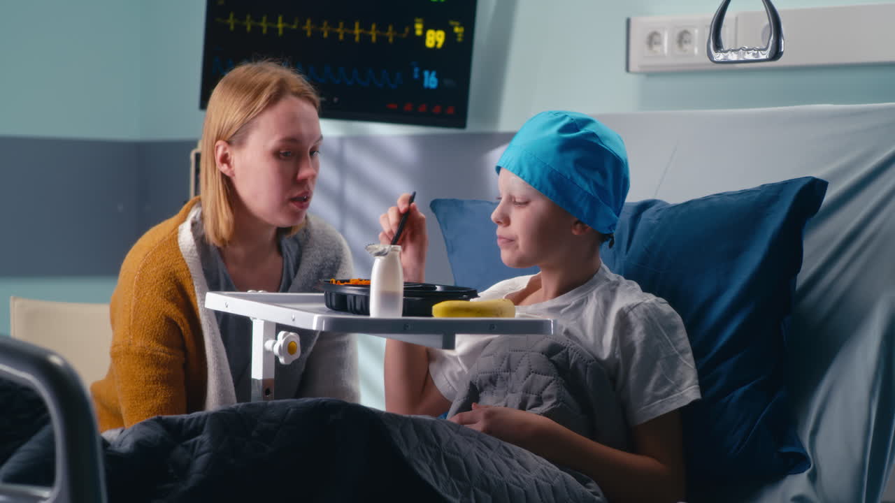 Mother Feeding a Child in Hospital