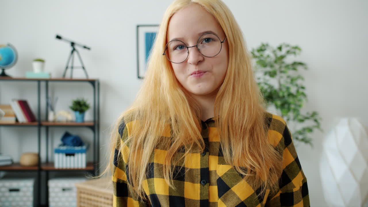Teenage Girl with Glasses in a Study Room