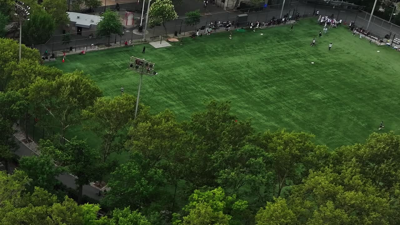 Vibrant green soccer field bustling with activity in New York City