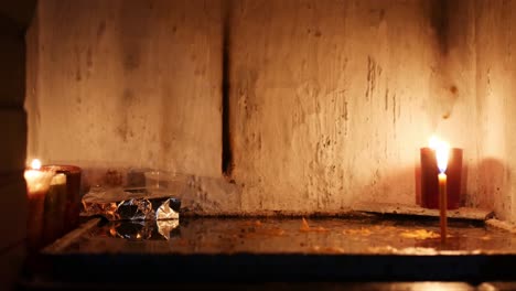 locked shot of burning candles in a tiny hermitage