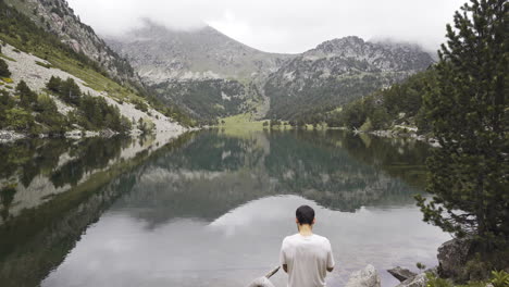 professional freelancer travel photographer taking photo of aiguestortes national park stunning location