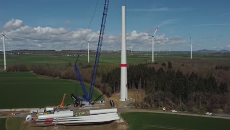 Large-Windmill-Under-Construction-In-The-Countryside---aerial-drone-shot