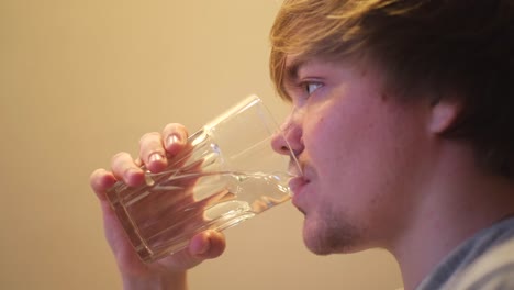 young man drinking water